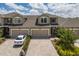 Charming townhome with a two-car garage, paver driveway and manicured landscaping at 5237 Blossom Cv, Lakewood Ranch, FL 34211