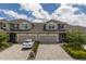Charming townhome with a two-car garage, paver driveway and manicured landscaping at 5237 Blossom Cv, Lakewood Ranch, FL 34211