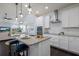 Bright, modern kitchen with a center island, granite countertops, and stainless steel appliances at 5237 Blossom Cv, Lakewood Ranch, FL 34211