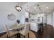 Open concept kitchen featuring stainless steel appliances, granite counters, and modern lighting at 5237 Blossom Cv, Lakewood Ranch, FL 34211