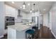 Bright, modern kitchen with a center island, granite countertops, and stainless steel appliances at 5237 Blossom Cv, Lakewood Ranch, FL 34211