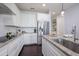 Bright, modern kitchen with a center island, granite countertops, and stainless steel appliances at 5237 Blossom Cv, Lakewood Ranch, FL 34211