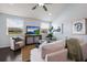 Bright living room featuring a comfortable white sofa, chair, and decorative elements at 5237 Blossom Cv, Lakewood Ranch, FL 34211