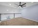 Open loft area featuring vaulted ceilings, ceiling fan, and natural light, creating a versatile living space at 5237 Blossom Cv, Lakewood Ranch, FL 34211
