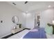 Comfortable bedroom with accent wall, bench and access to the ensuite bathroom at 5237 Blossom Cv, Lakewood Ranch, FL 34211