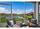 Relaxing screened porch with tranquil view of the lake at 5237 Blossom Cv, Lakewood Ranch, FL 34211