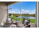 Relaxing screened porch with tranquil view of the lake at 5237 Blossom Cv, Lakewood Ranch, FL 34211