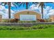 Welcoming entrance sign to Harmony at Lakewood Ranch, surrounded by colorful flowers and lush greenery at 5237 Blossom Cv, Lakewood Ranch, FL 34211