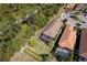 Aerial view of a home with screened in patio overlooking the manicured lawn and landscaping at 5301 Bartolomeo St, Sarasota, FL 34238