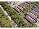 A lovely aerial view showcases a neighborhood's layout, green spaces, and screened in patios at 5301 Bartolomeo St, Sarasota, FL 34238