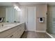 Bright bathroom features a double vanity with stone countertop and modern fixtures at 5301 Bartolomeo St, Sarasota, FL 34238