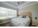 Cozy bedroom featuring a comfortable bed and ample natural light through the large window at 5301 Bartolomeo St, Sarasota, FL 34238