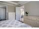 Bright bedroom features an array of drawers and view of the living room at 5301 Bartolomeo St, Sarasota, FL 34238