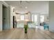 Dining area with a clear view of the modern kitchen and stainless steel refrigerator at 5301 Bartolomeo St, Sarasota, FL 34238