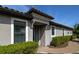 Inviting home entrance with meticulously maintained shrubs and a brick walkway at 5301 Bartolomeo St, Sarasota, FL 34238