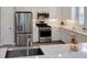 Well-equipped kitchen with stainless steel appliances and white shaker cabinets at 5301 Bartolomeo St, Sarasota, FL 34238