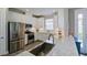 Charming kitchen with white cabinets, stainless appliances, and updated countertops at 5301 Bartolomeo St, Sarasota, FL 34238