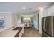 Bright kitchen with granite counters, stainless steel appliances, and easy access to the dining area at 5301 Bartolomeo St, Sarasota, FL 34238