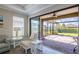 Relaxing outdoor lanai with a brick patio, ceiling fan and view of backyard at 5301 Bartolomeo St, Sarasota, FL 34238