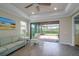 Comfortable living room with access to the lanai and open to the backyard at 5301 Bartolomeo St, Sarasota, FL 34238