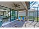 Enjoy outdoor living on this screened patio with comfortable seating and grill at 5301 Bartolomeo St, Sarasota, FL 34238