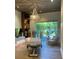 Onsite spa for community residents, featuring ample natural light, a massage table, and comfortable chair at 5301 Bartolomeo St, Sarasota, FL 34238