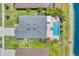 Aerial view of a home featuring a pool, fenced yard and lush greenery at 5717 71St E St, Palmetto, FL 34221