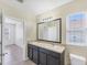 Bathroom with double sinks, and a large mirror at 5717 71St E St, Palmetto, FL 34221