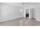 Bright bedroom with tile floors and view to the en-suite bathroom at 5717 71St E St, Palmetto, FL 34221