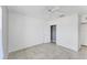 Simple bedroom featuring tile floors, a ceiling fan, and a closet at 5717 71St E St, Palmetto, FL 34221