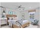 Modern bedroom featuring stylish decor, a patterned rug, and a ceiling fan at 5717 71St E St, Palmetto, FL 34221