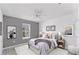 Cozy bedroom featuring a ceiling fan, an area rug, and neutral decor at 5717 71St E St, Palmetto, FL 34221