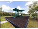A delightful community playground area with slides and structures offers fun for all at 5717 71St E St, Palmetto, FL 34221