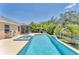 Inviting pool and spa combination surrounded by lush landscaping at 5717 71St E St, Palmetto, FL 34221