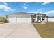 Charming single-story home with a three-car garage and well-maintained landscaping at 5909 33Rd E Dr, Palmetto, FL 34221