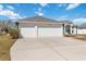 Charming single-story home with a three-car garage and well-maintained landscaping at 5909 33Rd E Dr, Palmetto, FL 34221