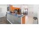 Open concept kitchen with stainless steel appliances and a breakfast bar at 5909 33Rd E Dr, Palmetto, FL 34221