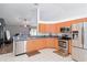 Bright kitchen featuring stainless steel appliances, ample cabinet space, and tile flooring at 5909 33Rd E Dr, Palmetto, FL 34221