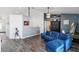 Comfortable living room with blue sofa, stylish decor, and modern flooring at 5909 33Rd E Dr, Palmetto, FL 34221