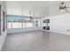 Enclosed sunroom featuring two ceiling fans, paneled walls, and sliding glass doors leading to the backyard at 5909 33Rd E Dr, Palmetto, FL 34221