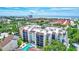 A beautiful aerial view of the condo with swimming pool and easy access to nearby beaches at 6157 Midnight Pass Rd # E65, Sarasota, FL 34242