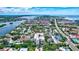 An aerial view showcasing the community's proximity to the intercoastal waterway and nearby beaches at 6157 Midnight Pass Rd # E65, Sarasota, FL 34242