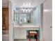 En suite bathroom with vanity and stool at 6157 Midnight Pass Rd # E65, Sarasota, FL 34242