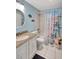 Bright bathroom featuring a granite countertop and tub/shower combo at 6157 Midnight Pass Rd # E65, Sarasota, FL 34242