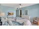 Bedroom featuring a king bed and private bathroom at 6157 Midnight Pass Rd # E65, Sarasota, FL 34242