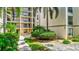 Beautiful courtyard and pathway surrounded by well maintained landscaping at 6157 Midnight Pass Rd # E65, Sarasota, FL 34242