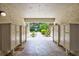 Well-lit mailroom featuring multiple mailboxes and a view of the garden at 6157 Midnight Pass Rd # E65, Sarasota, FL 34242