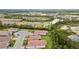 Beautiful aerial view of a residential community featuring tile roofs and lush landscaping at 620 Nasturtium Ct, Nokomis, FL 34275