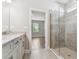 Bathroom with a glass shower and an adjoining bedroom at 620 Nasturtium Ct, Nokomis, FL 34275