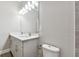 Bright bathroom with double sinks and a large vanity mirror at 620 Nasturtium Ct, Nokomis, FL 34275